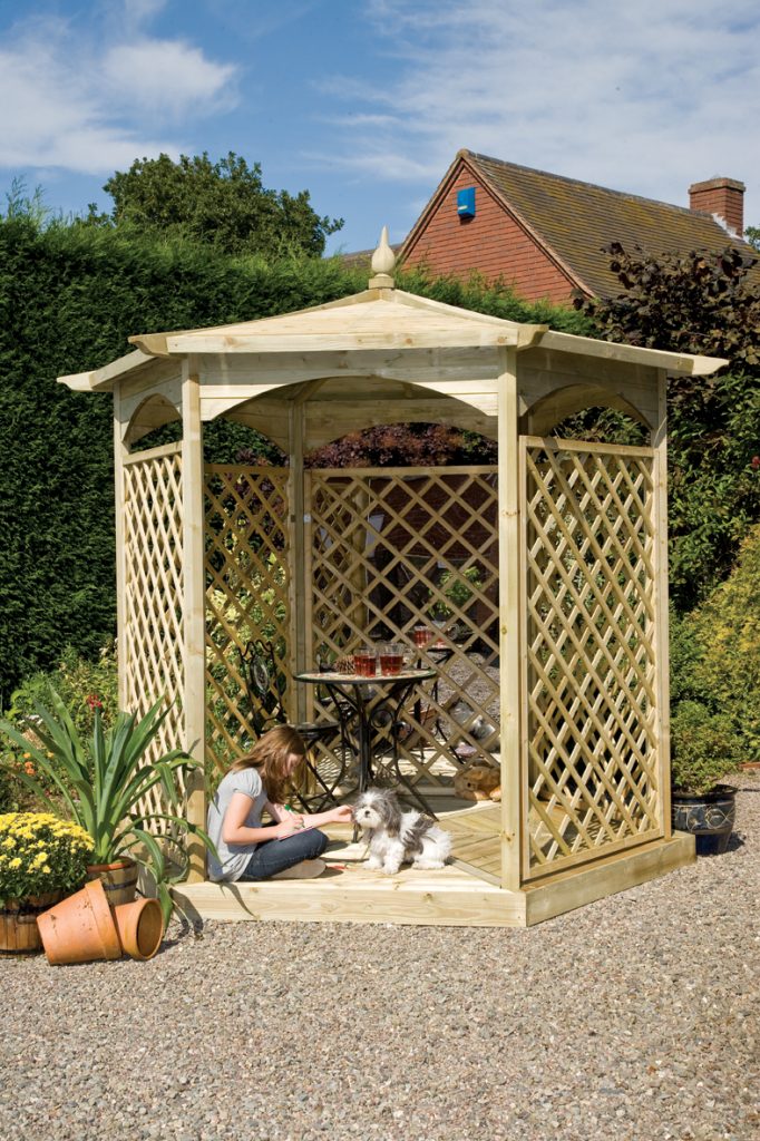 Wooden Gazebo with woman and dog in